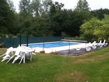 Solar heated saline pool